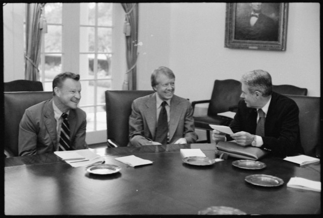 In this photo image from 1977, National Security Adviser Zbigniew Brzezinski is seen with US President Jimmy Carter and US Secretary of State Cyrus Vance. President Carter had reversed the policy of Dr. Henry Kissinger and had issued US visa to His Holiness the 14th Dalai Lama during 1979.
